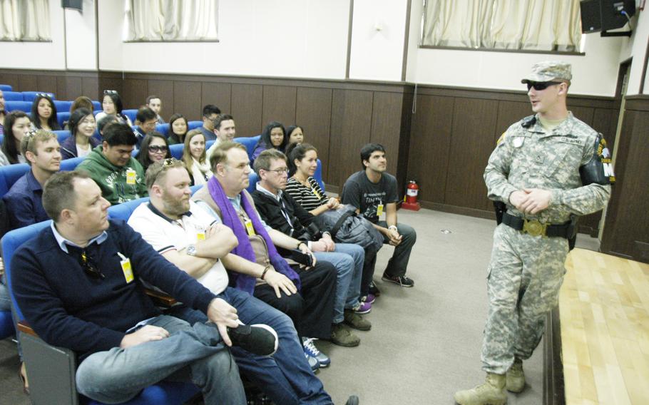 Pfc. Joshua Dixon, 23, of Brainerd, Minn. gives tourists a quick history of the Joint Security Area at Camp Bonifas, South Korea, near the Demilitarized Zone, in April 2015.