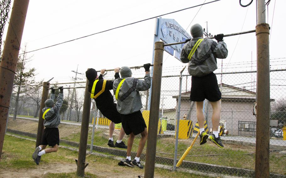 U.S. troops start the day with physical training at Camp Bonifas, South Korea, a few minutes' drive from the Demilitarized Zone, in April 2015.