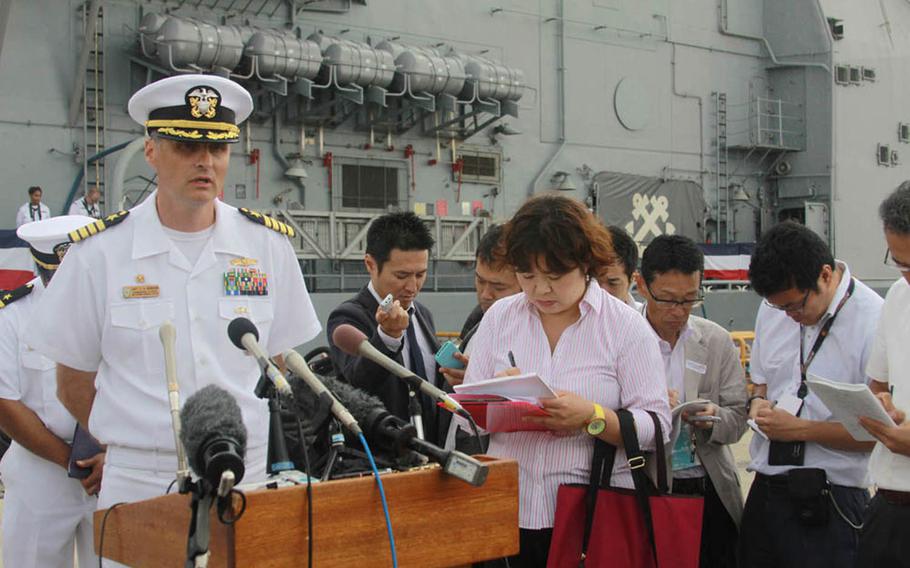 Capt. Curt A. Renshaw, the commanding officer of the guided-missile cruiser USS Chancellorsville, speaks to members of the Japanese media upon arriving at Yokosuka Naval Base, Japan, on June 18, 2015. The Chancellorsville is the only forward-deployed cruised fitter with the latest Aegis Baseline 9 combat system.