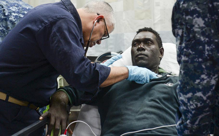 Medical personnel aboard the Military Sealift Command  hospital ship USNS Mercy give an injured person medical care during Pacific Partnership, June 30, 2015. 

Mayra A. Conde/U.S. Navy