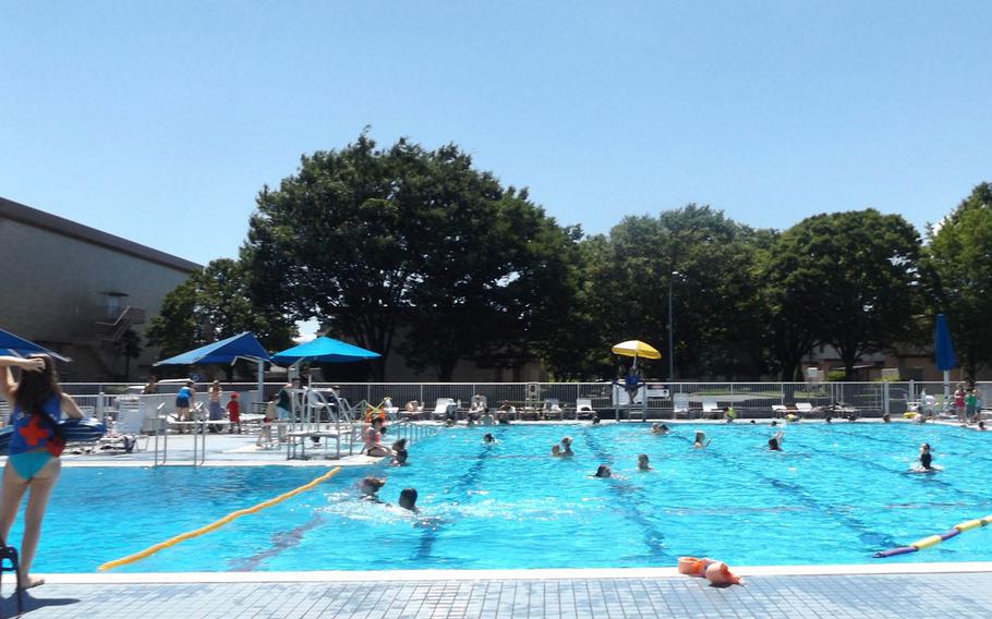 Families spend the day cooling off at the Sakana Pool at Yokota Air Base, Japan, on July 14, 2015. The Japan Meteorological Agency has posted heat advisories for much of the nation.