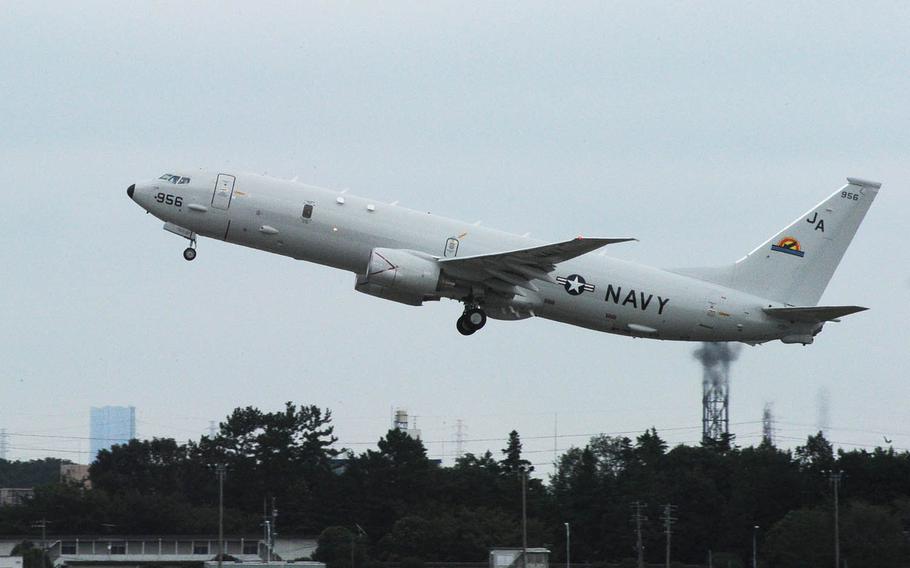 A P-8A Poseidon takes off at Naval Air Facility Atsugi, Sept 22, 2012. A group of residents living near Atsugi has appealed to the Supreme Court of Japan to end nighttime and early morning U.S. military flights.