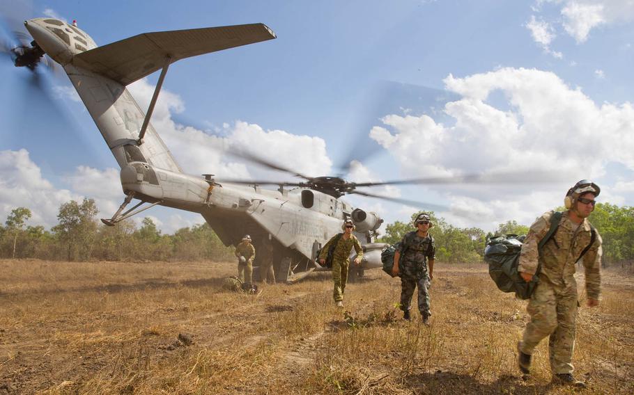 Australian Army, U.S. Army, U.S. Marine Corps and People's Liberation Army personnel disembark a U.S. Marine Corps CH-53E Super Stallion helicopter with Marine Heavy Helicopter Squadron 463, Marine Rotational Force-Darwin in the Northern Territory for Exercise Kowari 2015, Aug. 31, 2015.