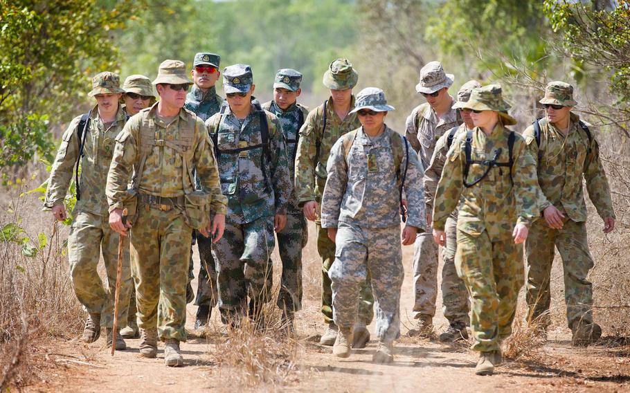 U.S. Marines, U.S. and Australian Army soldiers and People's Liberation Army personnel move to the survival training camp during Exercise Kowari 15 in the Northern Territory, Australia, Aug. 31, 2015. Kowari is environmental survival training hosted by Australia that includes the U.S., Australia and China.