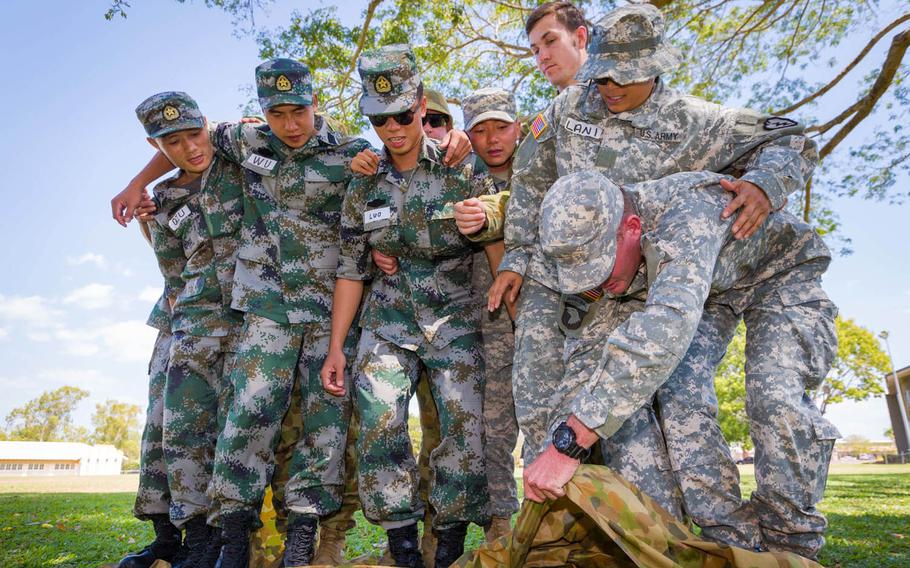 U.S. Marine Corps, U.S. Army, Australian Army and People's Liberation Army personnel participate in a team-building exercise before Exercise Kowari 15 at Larrakeyah Barracks in Darwin, Northern Territory, Aug. 28, 2015. Kowari is trilateral environmental survival training hosted by Australia that includes the U.S., Australia and China.