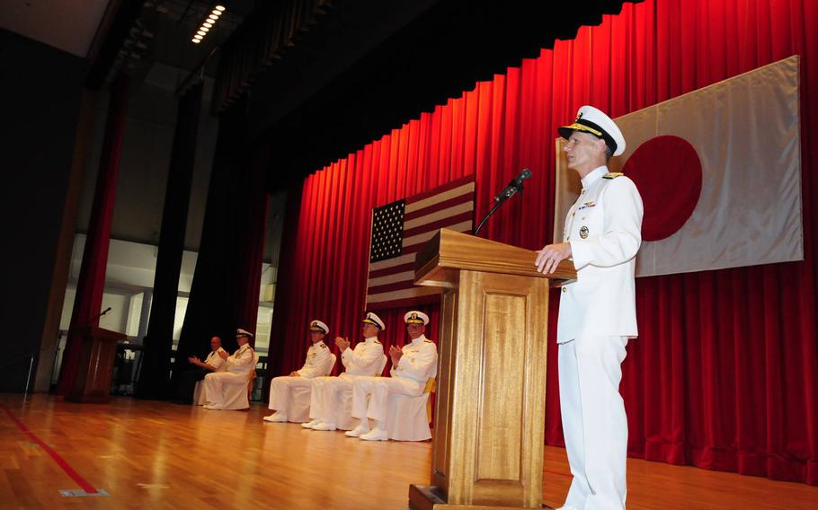 Vice Adm. Joseph P. Aucoin delivers remarks during a change-of-command ceremony Monday at Yokosuka Naval Base, Japan. Aucoin relieved Vice Adm. Robert L. Thomas as commander of the U.S. Seventh Fleet. 