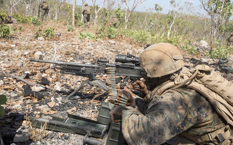 U.S. Marines with Company A, 1st Battalion, 4th Marine Regiment, Marine Rotational Force-Darwin offer fire support with M-240B medium machine guns during an air assault course Aug. 28, 2015, at the Mount Bundey Training Area, Northern Territory, Australia.