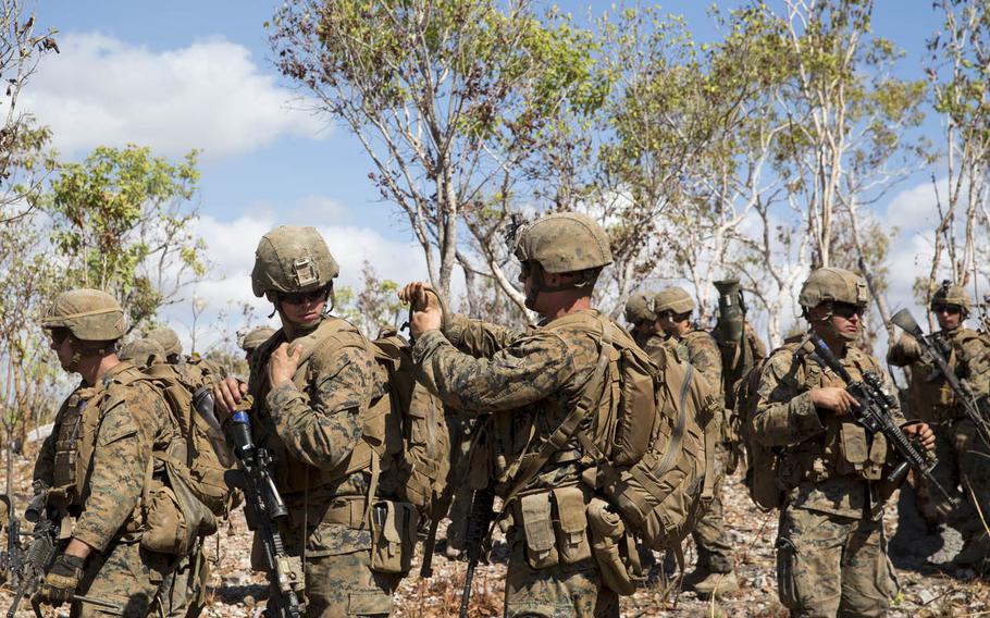 U.S. Marines with Company C, 1st Battalion, 4th Marine Regiment, Marine Rotational Force-Darwin prepare to take their objective point during an air assault course Aug. 24, 2015, at Mount Bundey Training Area, Northern Territory, Australia.