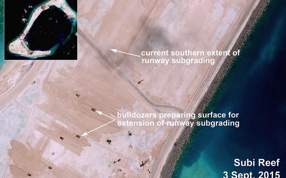 Satellite imagery purportedly shows bulldozers clearing the way for runway grading preparation on Subi Reef in the South China Sea on Sept. 3, 2015.