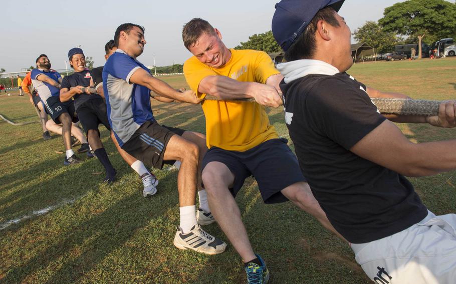 Sailors from the U.S. and Indian navies and the Japan Maritime Self-Defense Force complete in tug-of-war Wednesday, Oct. 14, 2015, during Exercise Malabar 2015. Malabar is annual sea and shore training aimed at enhancing maritime security in the Indo-Pacific region.