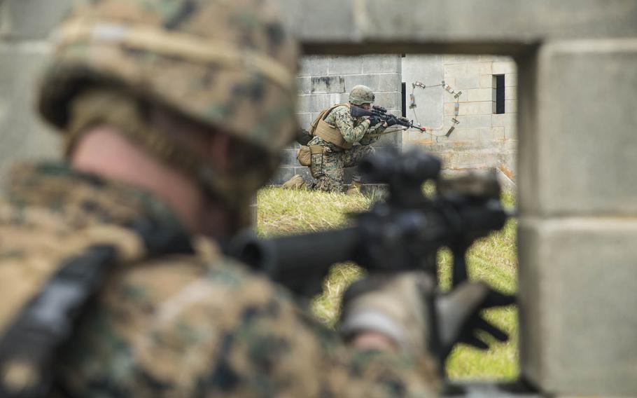 Marines take over Combat Town at the Central Training Area, Okinawa, Japan, Monday, Oct. 26, 2015. Marines rode in on amphibious assault vehicles during the exercise, which was part of Blue Chromite 2016. The Marines are from Combat Assault Battalion, 3rd Marine Division, III Marine Expeditionary Force.