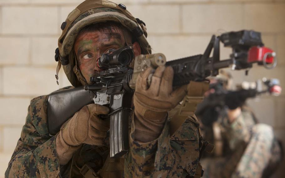Lance Cpl. Dakota A. Kaiser engages enemy units during a raid on Combat Town, Central Training Area, Okinawa, Japan, Monday, Oct. 26, 2015. The raid was part of Blue Chromite 2016, a large-scale exercise that aims to achieve high-level training at a low cost, while keeping naval forces in a forward-deployed posture.