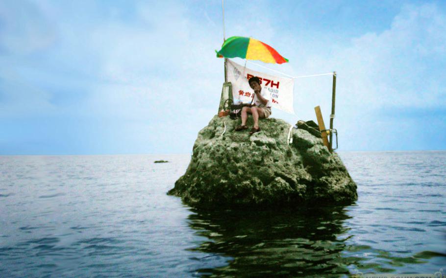 An amateur radio team operates from one of the rocks forming Scarborough Shoal, in 1995. The shoal was the site of a Chinese and Philippine naval standoff in 2012. Rocks like these are scattered through the South China Sea. Multiple nations, and China in particular, are reclaiming the surrounding area around rocks and reefs and building military installations.