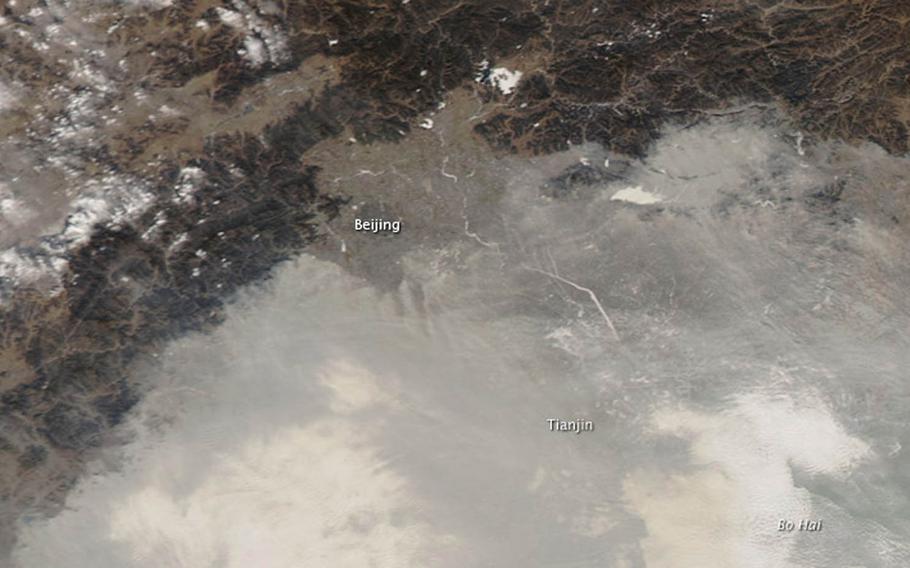 Fog and haze blanket the North China Plain on Jan. 10, 2012. The effects of climate change on China will present a "major security challenge" this century for the United States and Asia, according to a Center for Climate and Security study released Tuesday, Nov. 17, 2015.