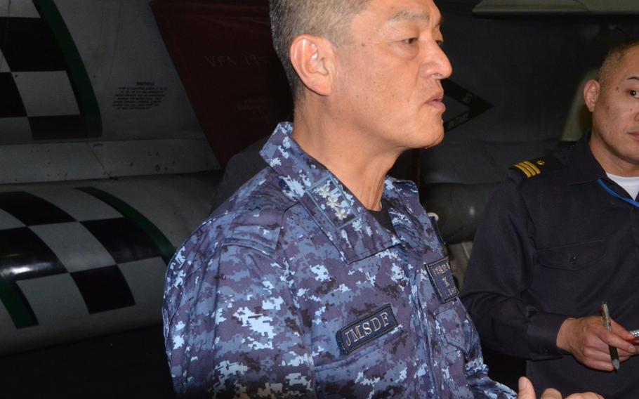 Vice Adm. Yasuhiro Shigeoka, commander of the Japanese Maritime Self-Defense Force, tells reporters aboard the USS Ronald Reagan on Tuesday that while Japan has no plans of patrolling the South China Sea with the U.S. Navy, it maintains the capability.