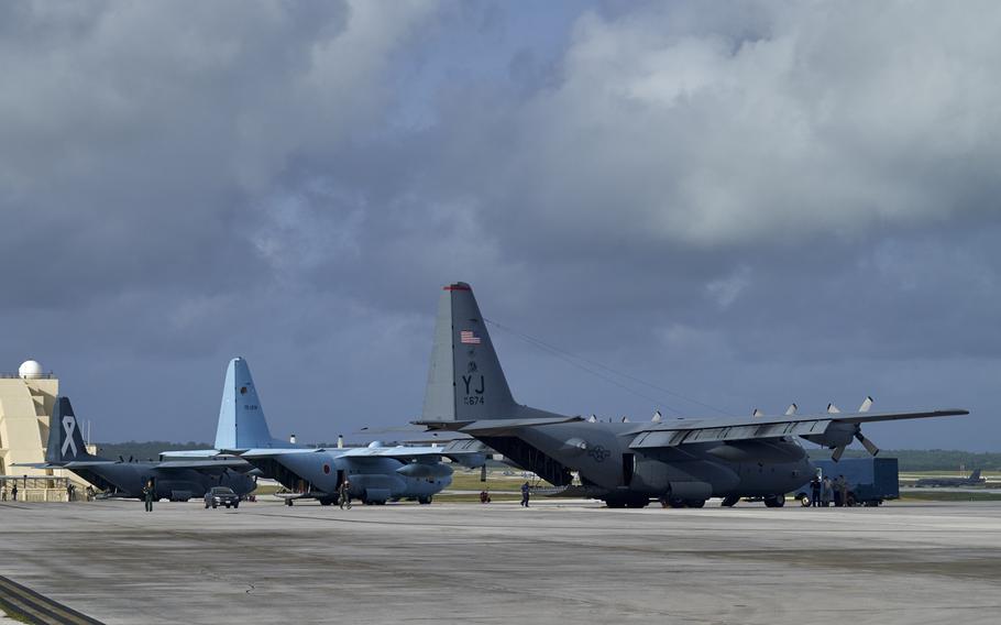 Three C-130 Hercules planes sit at Andersen Air Force Base, Guam, as they are prepared for humanitarian missions to remote parts of the Northern Marianas Islands, Federated States of Micronesia and Republic of Palau on Wednesday, Dec. 9, 2015.