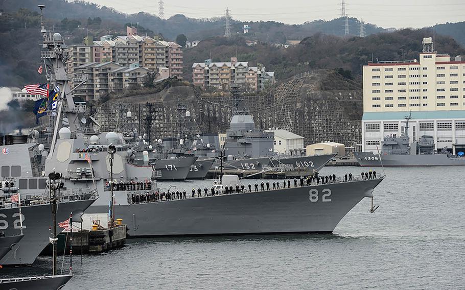 The Arleigh Burke-class guided-missile destroyer USS Lassen, center, departs Yokosuka Naval Base, Japan, for the final time as part of the forward-deployed naval forces, Wednesday, Jan. 6, 2016. Lassen will return to the U.S. later this year after 10 years of being forward-deployed to the Indo-Asia-Pacific with Destroyer Squadron 15.