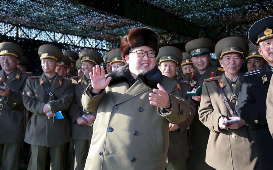 North Korean leader Kim Jong Un smiles while watching the Korean People's Army tank crews' competition at an unknown location, in this undated photo released by North Korea's Korean Central News Agency. In the last few days, North Korea has launched a series of missiles that landed in the North Sea.