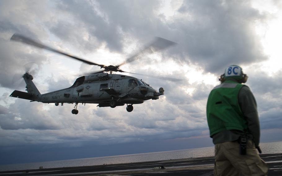 An MH-60R Sea Hawk takes off from the USS Dwight D. Eisenhower on Thursday, Dec. 8, 2016.