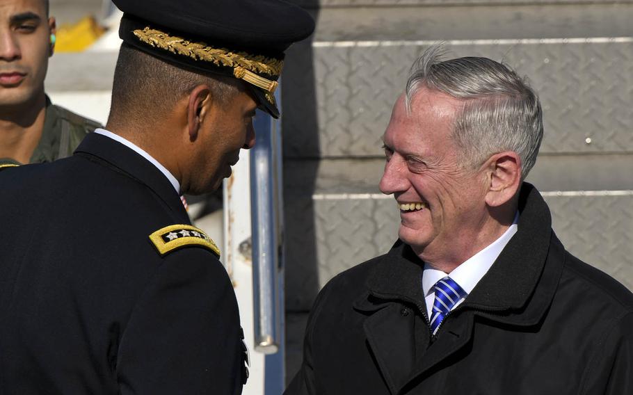 Defense Secretary Jim Mattis greets Gen. Vincent Brooks, U.S. Forces Korea commander, as he arrives at Osan Air Base, South Korea, Thursday, Feb. 2, 2017.