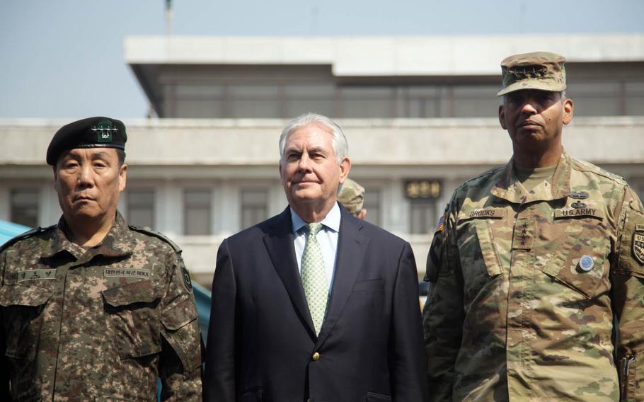 Secretary of State Rex Tillerson, center, poses with Gen. Vincent Brooks, right, U.S. Forces Korea commander, and South Korean Gen. Leem Ho Young at the Joint Security Area of the Demilitarized Zone, Friday, March 17, 2017.