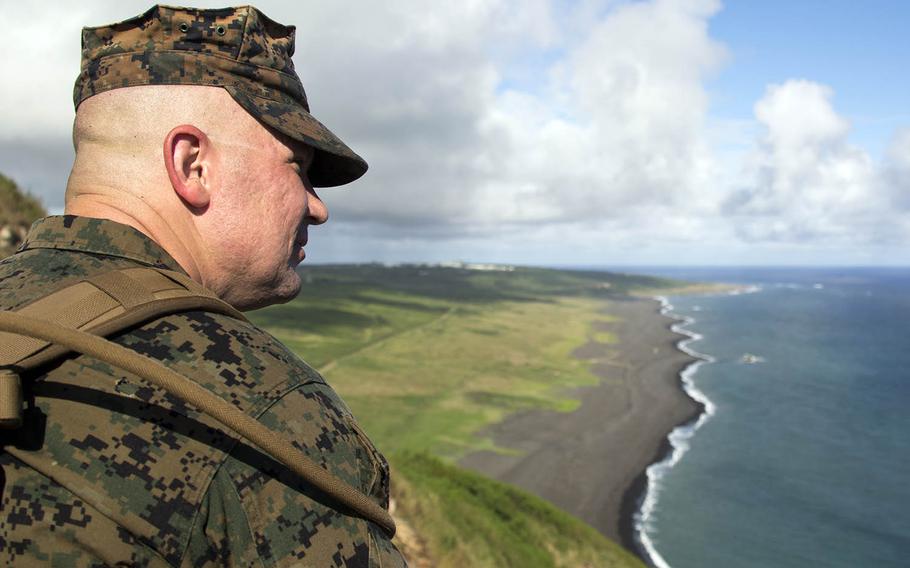 A Marine from Marine Corps Air Station Iwakuni, Japan, gazes out from atop Iwo Jima's Mount Suribachi, Nov. 7, 2017.