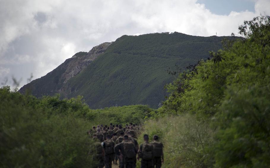 Servicemembers from Marine Corps Air Station Iwakuni, Japan, hike up Mount Suribachi on Iwo Jima, Nov. 7, 2017.