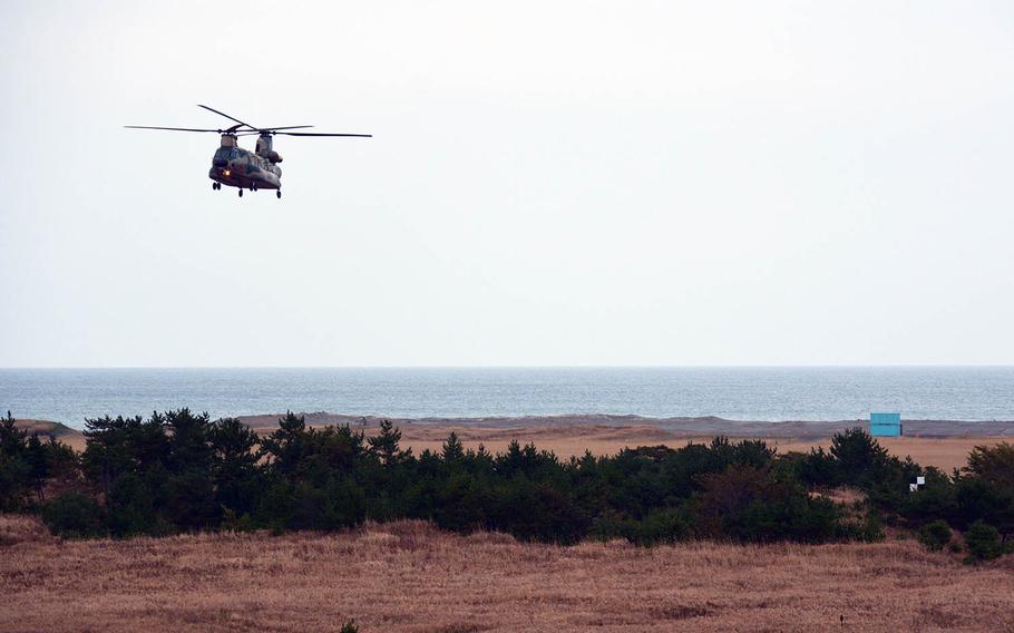 A Japanese CH-47 Chinook helicopter hovers over Draughon Range near Misawa Air Base, Japan, Nov. 14, 2017.