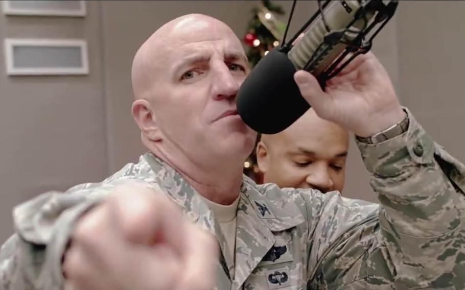 Col. Kenneth Moss, commander of the 374th Airlift Wing at Yokota Air Base, Japan, raps a holiday greeting in a video posted on the base's official Facebook page.