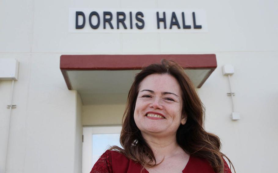 Chikako McMaster poses outside Dorris Hall at Camp Courtney, Okinawa, Friday, Dec. 22, 2017. The barracks were named for her father, Navy Cross recipient Marine Staff Sgt. Claude Dorris.