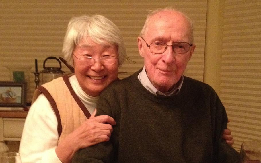 Shin-ja and Stephen Bradner pose at their home in Saunderstown, R.I., Dec. 23, 2014.