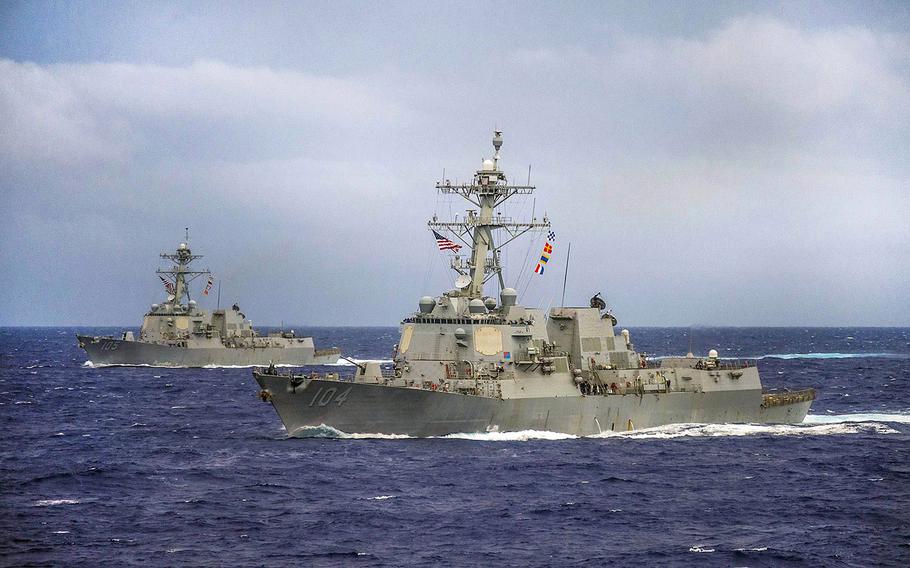 The guided-missile destroyers USS Sterett, foreground, and USS Dewey maneuver into formation in the Pacific Ocean during exercise Valiant Shield 2014.