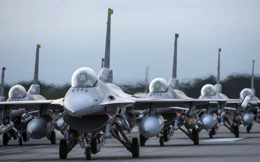 F-16 Fighting Falcons line the runway during an elephant walk at Misawa Air Base, Japan, Sept. 16, 2017.