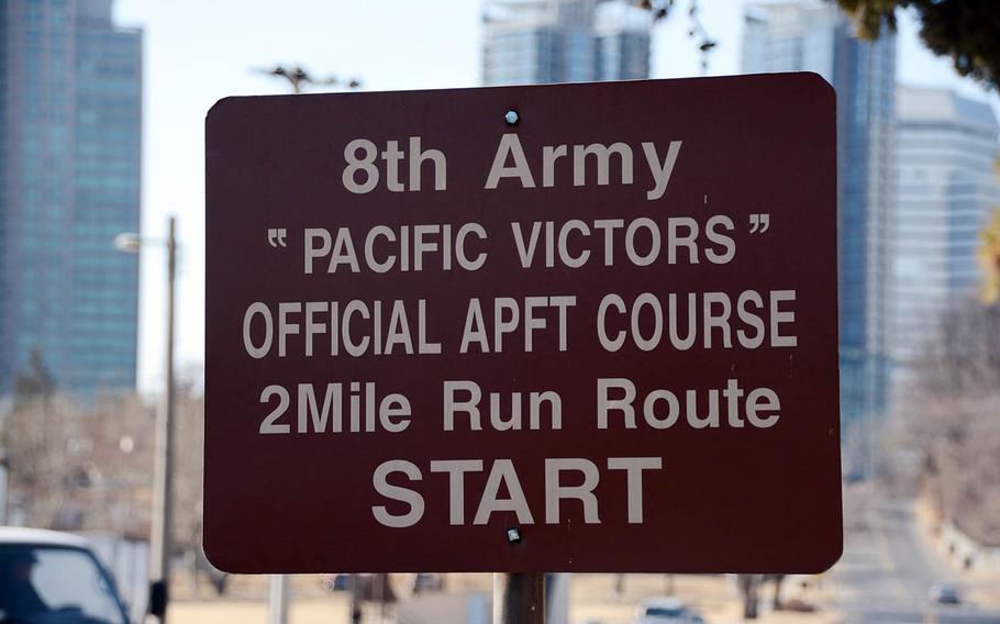 An 8th Army sign with the Seoul skyline as a backdrop serves as a reminder of the U.S. military presence at Yongsan Garrison, South Korea, Saturday, Feb. 17, 2018.