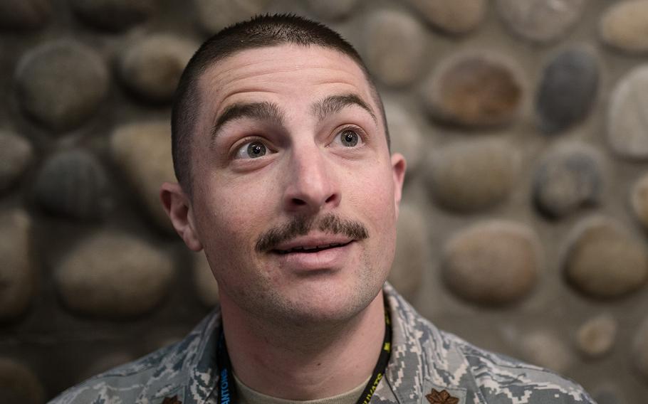 Justin Shetter of the 8th Aircraft Maintenance Squadron, 8th Fighter Wing displays his mustache at Kunsan Air Base, South Korea, Tuesday, March 27, 2018.