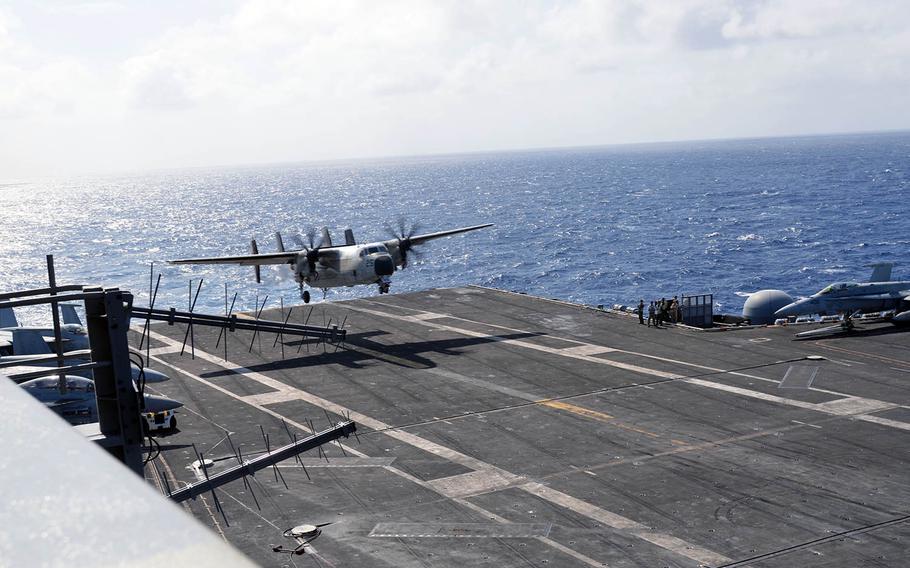 A C-2A Greyhound lands on the flight deck of the USS Carl Vinson last month in the Philippine Sea.
