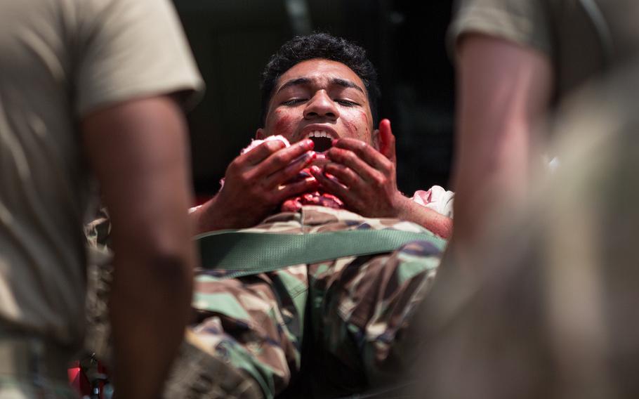 A soldier plays a victim during a mass casualty scenario at the 121st Combat Support Hospital at Camp Humphreys, South Korea, Friday, April 20, 2018.