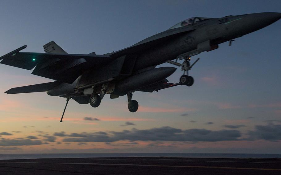 An F/A-18E Super Hornet from Strike Fighter Squadron 115 prepares to land last year aboard the USS Ronald Reagan in the Coral Sea.