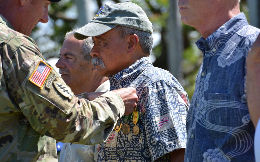 Allen Hoe, a former Army combat medic, is awarded a Bronze Star, Army Commendation Medal, Purple Heart, Combat Medical Badge and Vietnam Service Medal during a ceremony at Fort Shafter, Hawaii, June 29, 2018.