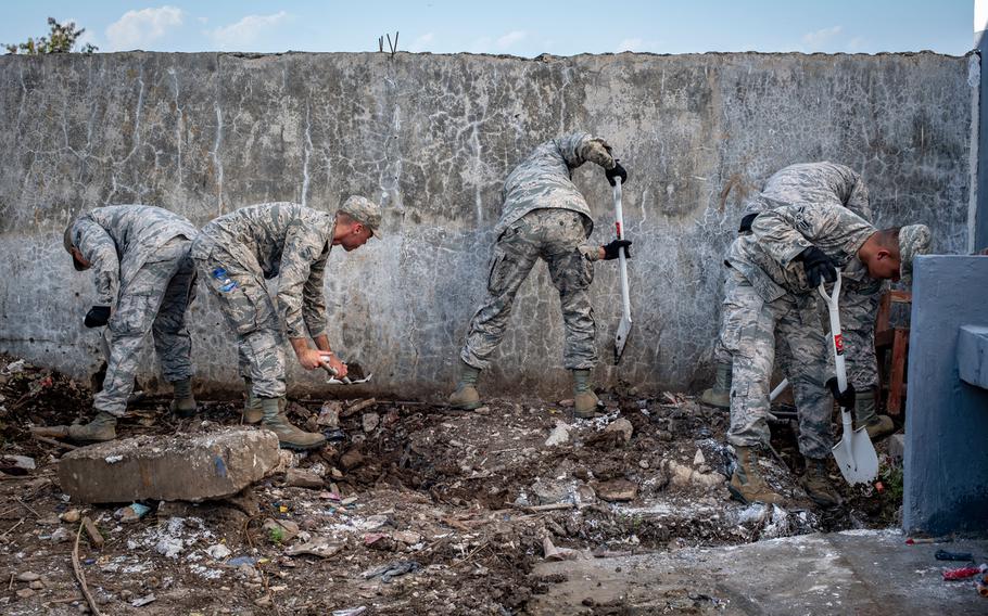 U.S. Air Force engineers with the 18th Civil Engineer Squadron from Kadena Air Base, Japan, correct the slope of a drainage pipe at the Negri Saran Kote Secondary School during Pacific Angel 2018 in Suai, Cova Lima Municipality, Southwest Timor-Leste, June 9, 2018.