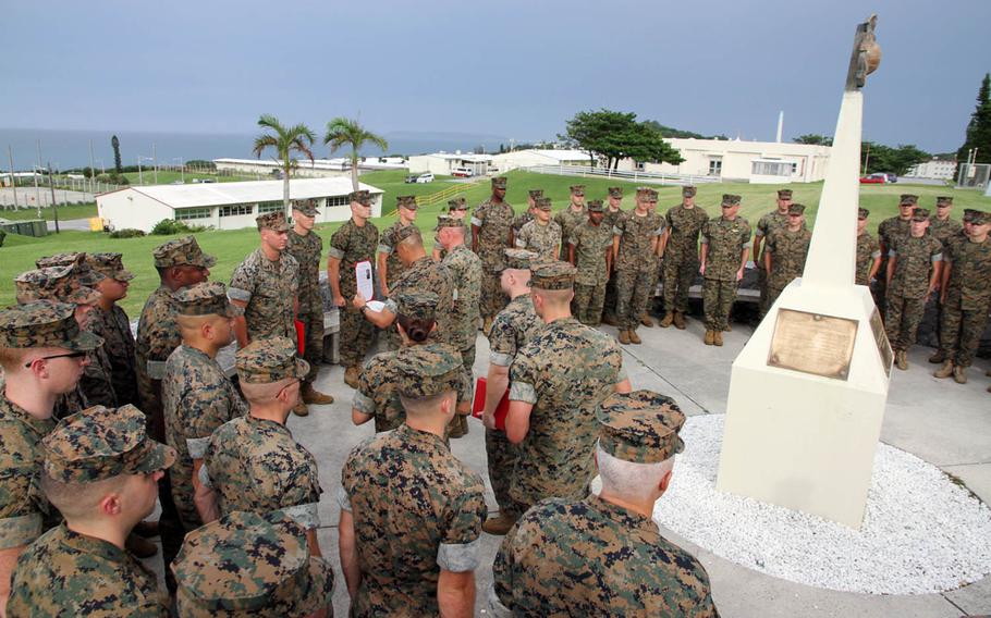 Lt. Gen. Lawrence Nicholson, III Marine Expeditionary Force commander, meritoriously promotes five Marines and a Navy corpsman at Camp Courtney, Okinawa, Thursday, Aug. 2, 2018.