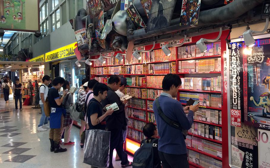 Shoppers at Nakano Broadway in Tokyo peruse the many manga comics at a Mandrake chain store. The shopping center is a four-story treasure trove of individual shops selling goods featuring some of Japan’s most famous anime and manga franchises — and some obscure ones, too.