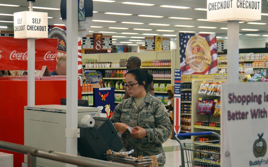 An airman uses a self-checkout kiosk inside the commissary at Yokota Air Base, Japan, Wednesday, Aug. 22, 2018.