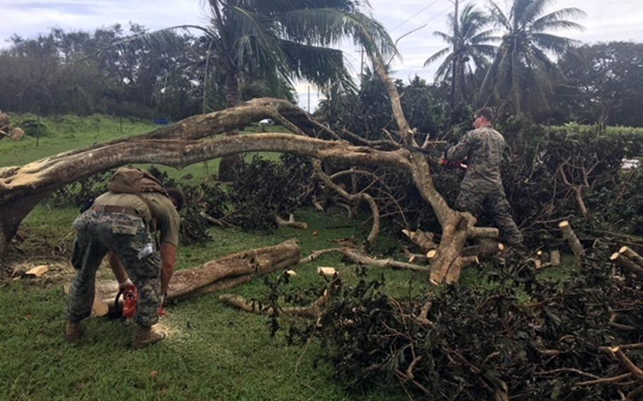Marines and Seabees clear debris on Tinian Island caused by Typhoon Mangkhut, Tuesday, Sept. 11, 2018.