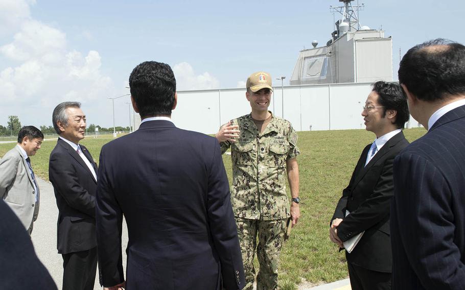 Cmdr. Axel Steiner of Aegis Ashore Missile Defense System Romania gives a tour to members from the Japanese Diet, July 31, 2018.