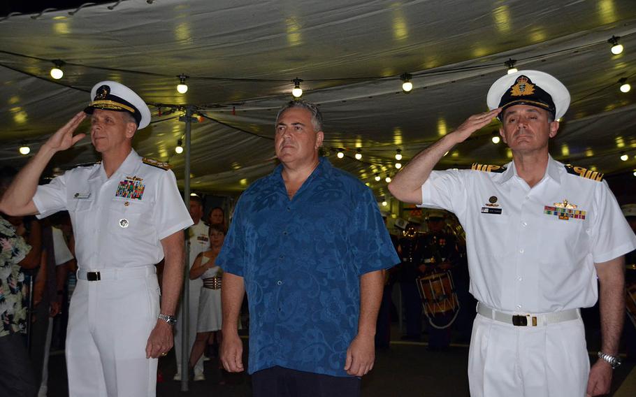 Australian Ambassador to the United States Joe Hockey stands between U.S. Indo-Pacific Commander Adm. Philip Davidson, left, and Capt. John Stavridis, commander of the HMAS Hobart, during a ceremonial sunset aboard the Hobart at Pearl Harbor, Hawaii, Sept. 18, 2018.