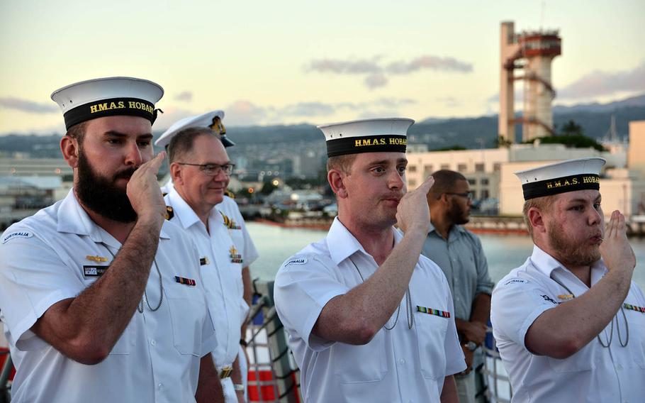 Sailors of the HMAS Hobart pipe officers aboard the Australian destroyer at Pearl Harbor, Hawaii, Tuesday, Sept. 18, 2018.