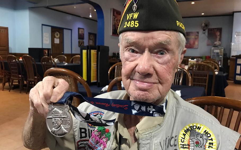 Willis "Buddy" Clark Jr. shows off the medal he received for 75 years of service to the Boy Scouts in Angeles City, Philippines, Saturday, Sept. 22, 2018.