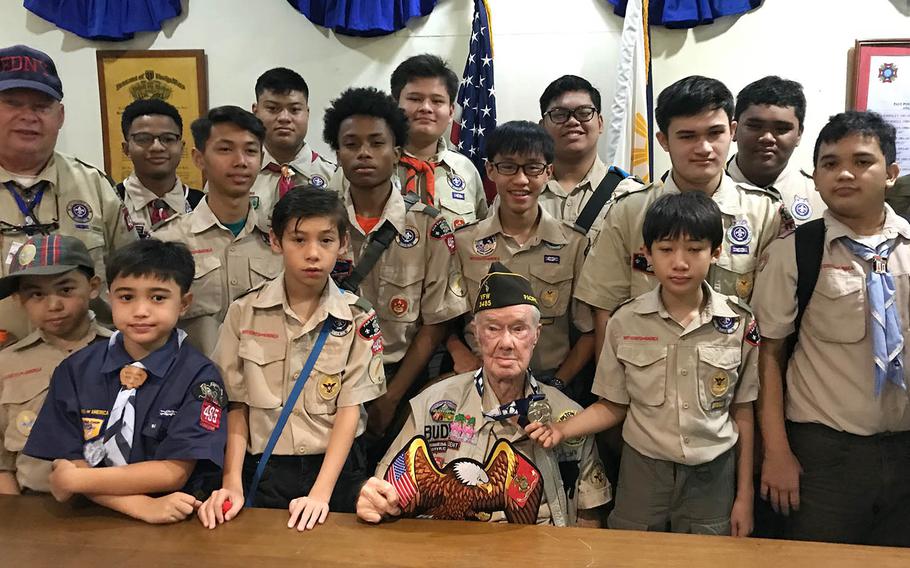Willis "Buddy" Clark Jr., 87, poses with members of Boy Scout Troop 485 in Angeles City, Philippines, Saturday, Sept. 22, 2018.