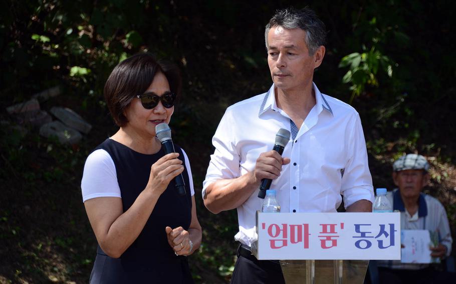 Sculptor Kim Won-sook and her husband, Thomas Park Clement, a South Korean adoptee who now lives in the United States and has financed efforts to use DNA tests to find birth parents, speak at a ceremony in Paju, South Korea, Sept. 12, 2018.